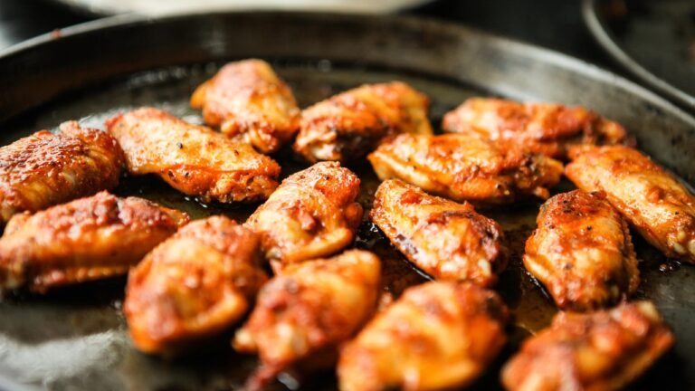 chicken wings on a black plate