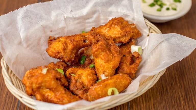 chicken wings in a take out dish